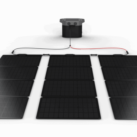 High-efficiency solar panels connected to a portable power station, capturing renewable energy for off-grid living. Ideal for eco-friendly, off-grid power solutions, camping, or sustainable energy independence.